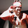 ( You've got to respect someone who wears an elephant on her head and comes on stage in a little push car! )