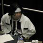 ( Artists in Artists Alley, busy working on commissions. )