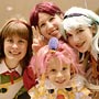 Four young cosplayers crowd for the camera.  *Heavily Edited*