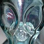 This is not an alien head.  This is a close up examination of a Japanese drink bottle, complete with marble.